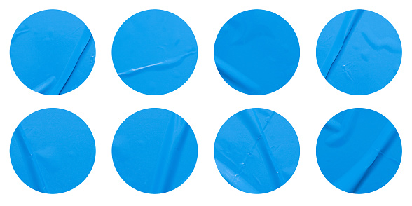 Set of round blue paper stickers mock up blank tags labels, isolated on white background with clipping path for design work