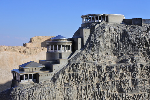 Masada - Nov 10 2022:Scaled model of Masada ancient natural fortress in Holy land Israel.King Herod the Great built two palaces for himself on the mountain and fortified Masada between 37 and 31 BCE.