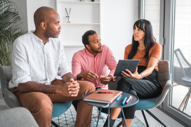 istock Multiracial People In A Meeting At A Private Clinic 1448259467