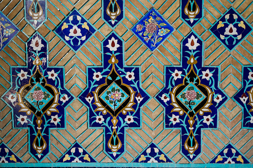 Awesome view of the upper group of mausoleums at the Shah-i-Zinda Ensemble in Samarkand, Uzbekistan. Mausoleums decorated by blue tiles with designs are a popular tourist attraction of Central Asia.