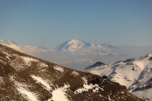 Aerial View of Tochal mountain peaks, Alborz mountain range, Tehran Iran. Famous for its snow peaks for skiing.