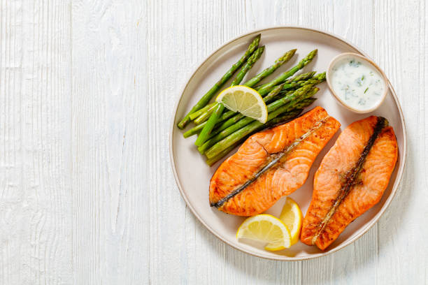 istock roast salmon steaks with asparagus and dill sauce 1448262781