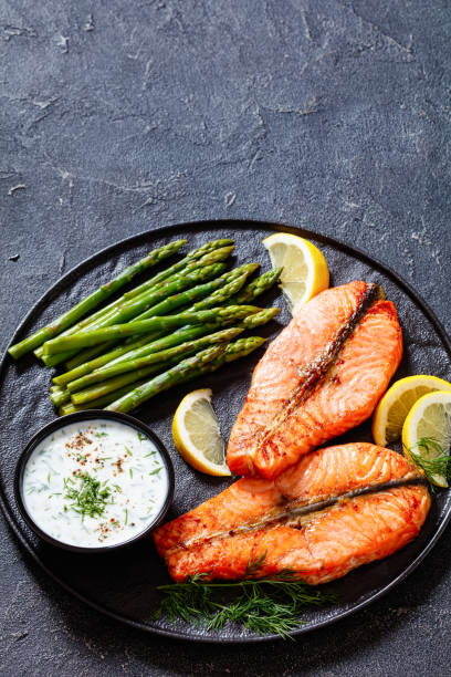 istock roast salmon steaks with asparagus and dill sauce 1448262814