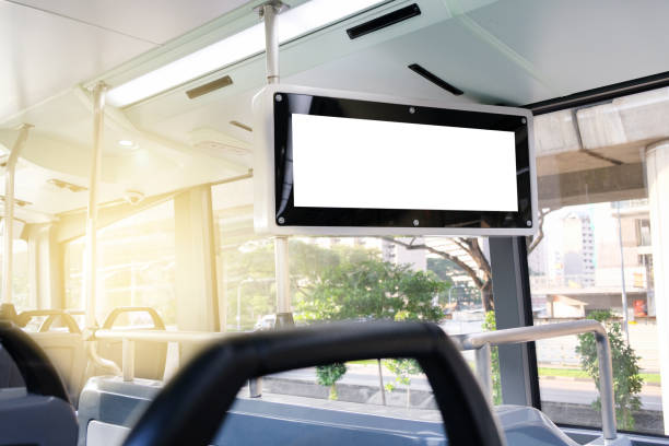 istock Screen display mockup in the public bus. Template of an empty information inside bus to show destination and stopping station, Mock-up of a city banner placeholder and poster. 1448264365