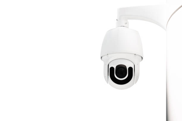istock Modern public CCTV camera on wall isolated on white background. Intelligent reccording cameras for monitoring all day and night. Concept of surveillance and monitoring with clipping path copy space. 1448264617