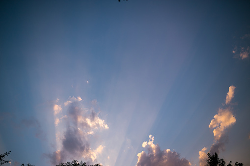 Blue sky with clouds and sun