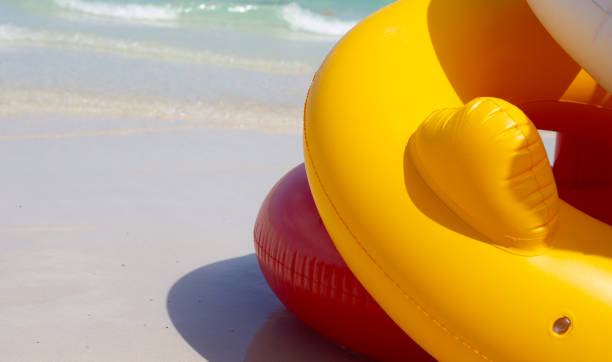 istock Inflatable rings on the beach. Summer concept 1448268504
