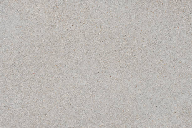 istock Dirty concrete and white old cement wall.Grungy rough surface wall. 1448270496