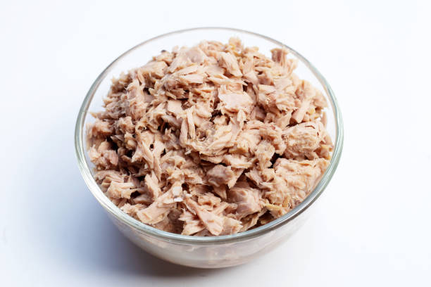 istock Canned tuna in glass bowl on white background. 1448271681