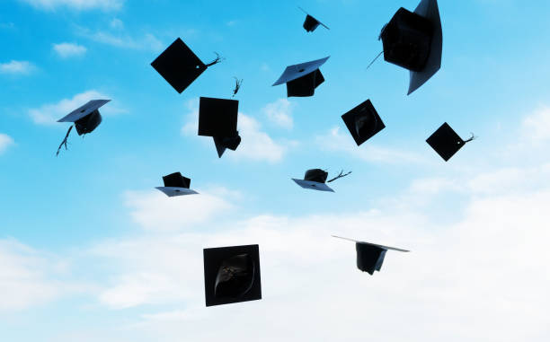 istock Group of graduation caps thrown in the air 1448272497