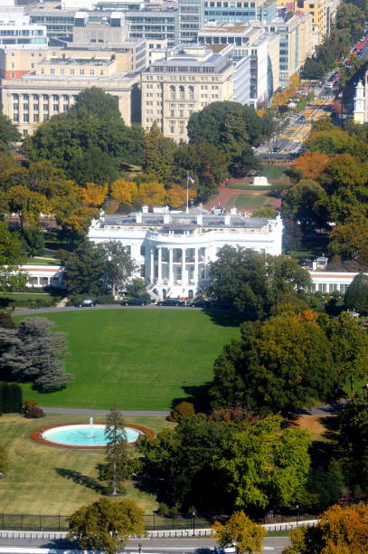 istock High angle view of the White House against Washington DC 1448276093
