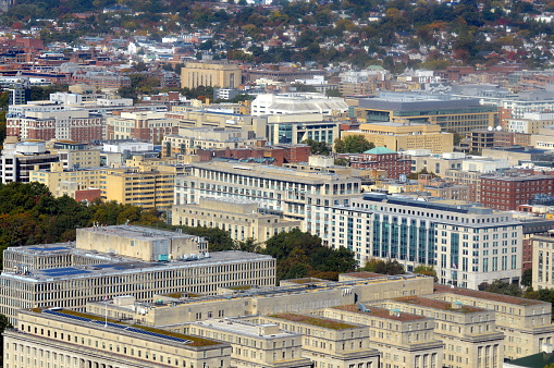 AERIAL: Flying above Upper East side overlooking lush green Central Park along the 5th Avenue in sunny New York City. Luxury condominium apartment buildings with Central Park view and MET museum