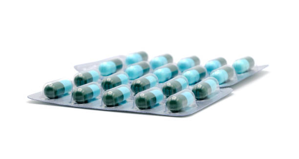 istock Close up on tablets and capsules pill in blister packaging, Pharmaceutical industry concept. Pharmacy drugstore, Amoxicillin capsule pills isolated on white background. 1448276767