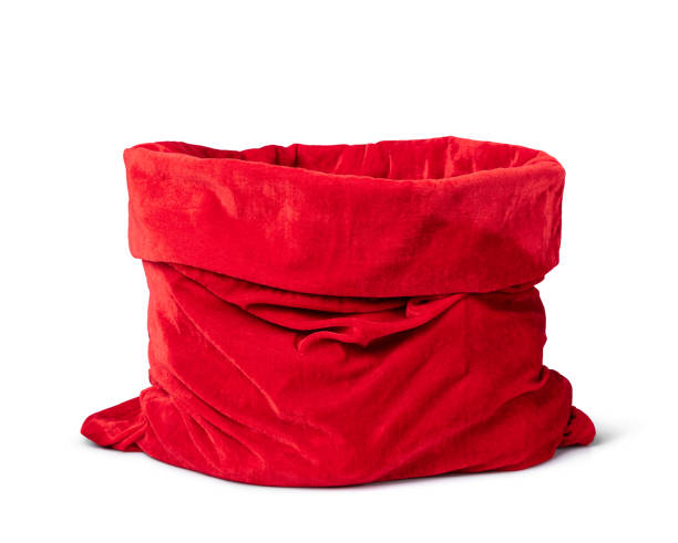 istock Santa Claus open red bag full, isolated on white background. File contains a path to isolation. 1448279483