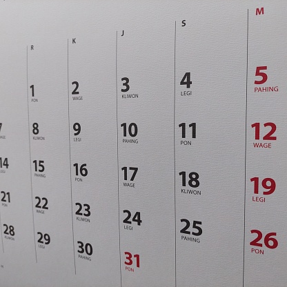 wall or desk calendar design with a white background accompanied by the Javanese calendar