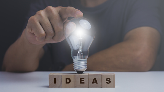 Ideas concept, man point light bulb, innovation technology, inspiration.