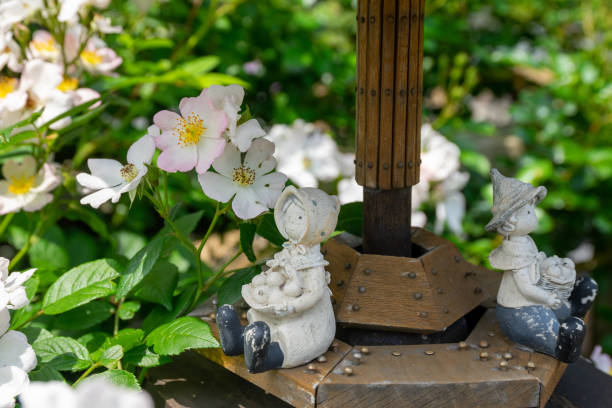 Garden statue. A vintage stone statue of a roman lady decorated in the outdoor garden.