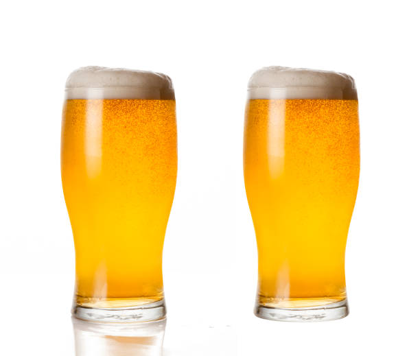 istock glass of light beer isolated on white background. 1448283783