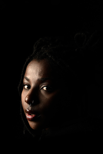 Studio portrait of beautiful serious African teenager