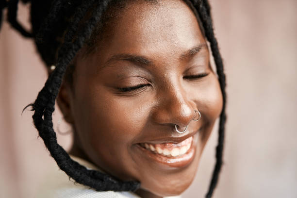 istock Cheerful african woman with eyes closed 1448284025
