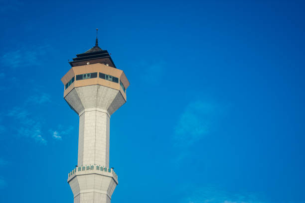 istock The minaret of the mosque with a blue sky background 1448292376