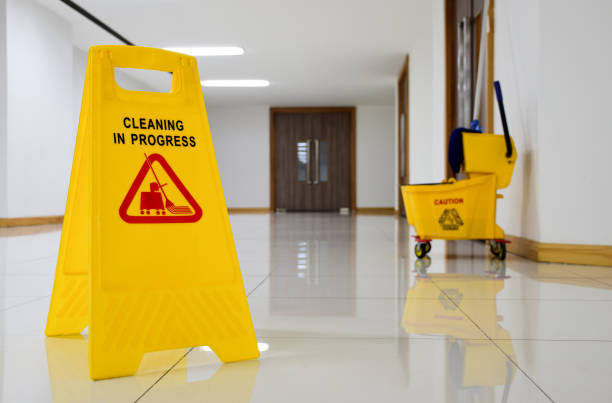 istock Close up yellow warning sign with message Cleaning in progress 1448292573