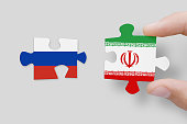Puzzle made from flags of Russia and Iran. Russia and Iran relations and military coperations