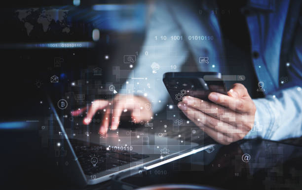 istock IoT, Internet of Things, digital marketing, E-commerce, global business, digital technology concept. Woman using mobile phone and laptop for online working and searching data 1448293700