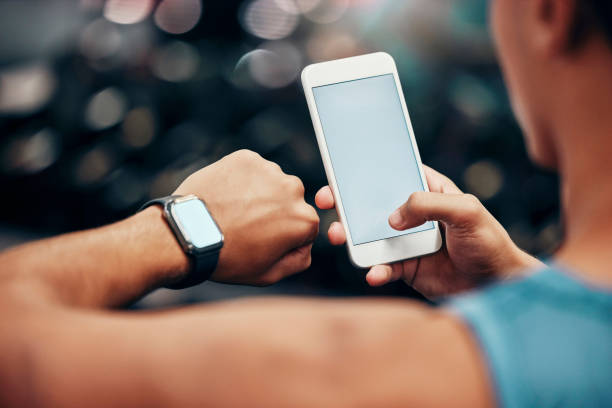 istock Mockup, tech and woman with smartwatch and phone linking mobile app, time and online data. Advertising, marketing and person using smartphone and digital wristband with blank, empty screen 1448294918