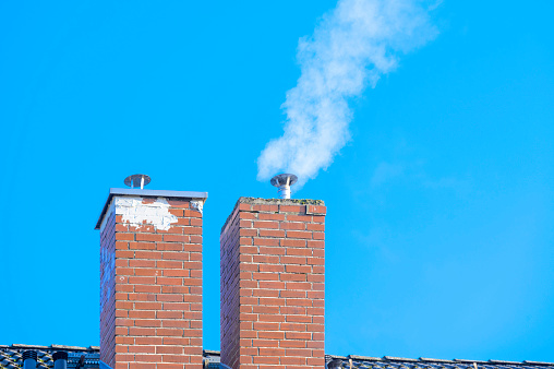White Air pollution from chimney of the factory.