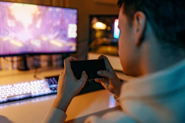istock Gamer playing games at home 1448296329