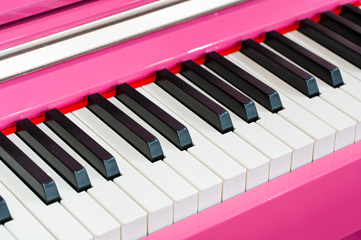 Pink piano and piano keyboard