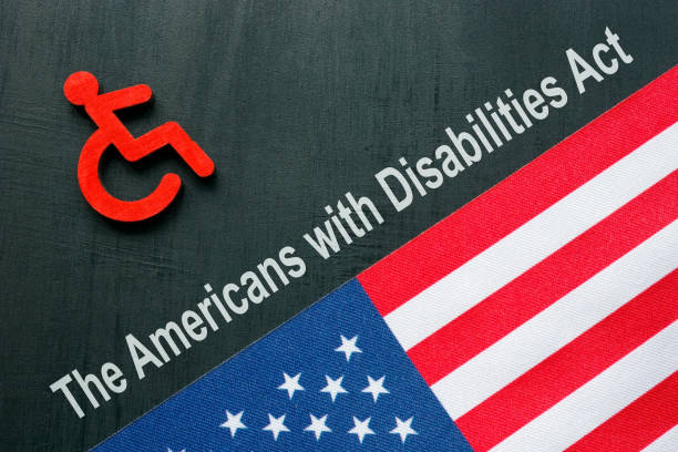 ADA or The Americans with Disabilities Act concept. Disabled person sign and USA flag. stock photo