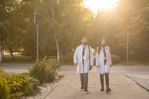 istock Doctors walking in hospital complex 1448302653