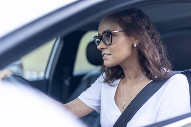 istock Woman driving an electric car 1448303154