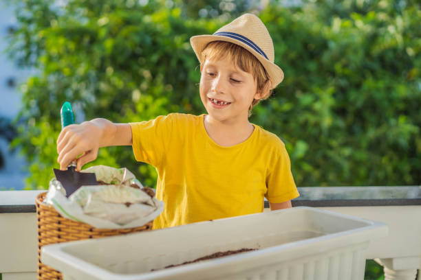 istock The boy is doing gardening on his balcony. Natural development for children 1448305844