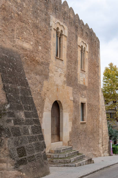 istock Old building with arch and stone staircase 1448307335