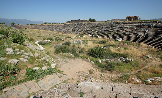 Bergama, Turkey - August 26, 2023:ACROPOLIS OF PERGAMON\nIn 2014, Bergama was included in the World Cultural Heritage List. Although Bergama has been subjected to invasions and destructions throughout its history, it has been continuously inhabited due to its strategic location and is one of the settlements that have never disappeared from the stage of history.  \n Local and foreign tourists visit here