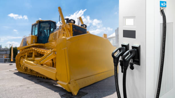 istock Electric construction machines with charging station. 1448308949
