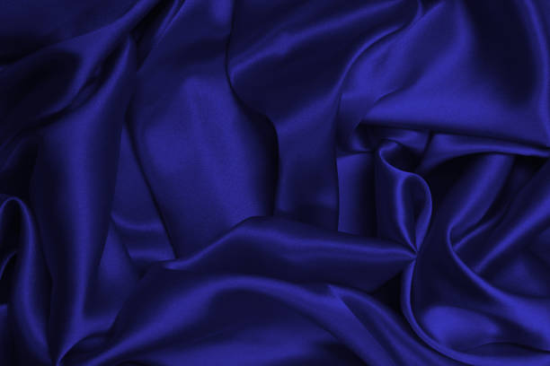 istock Rich and luxury red silk fabric texture background. 1448310138
