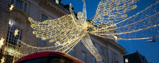 istock Illuminated Christmas angel decorations hanging over Piccadilly, London 1448312027