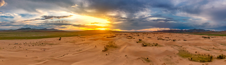 Aerial panorama view of the sand dunes Elsen Tasarhai (Bayan Gobi) desert at sunset in Mongolia