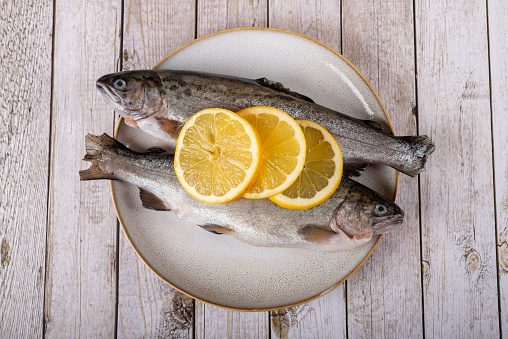 fish with lemon - omega 3, vitamin A or E - rainbow trout