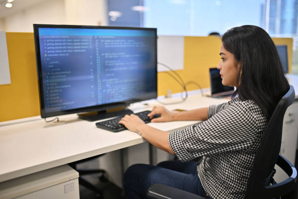 Woman working on a computer in an office