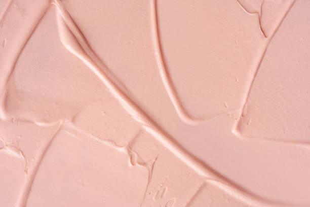 istock Pink cosmetic clay smudge background. Pink creamy cosmetic texture. 1448320253