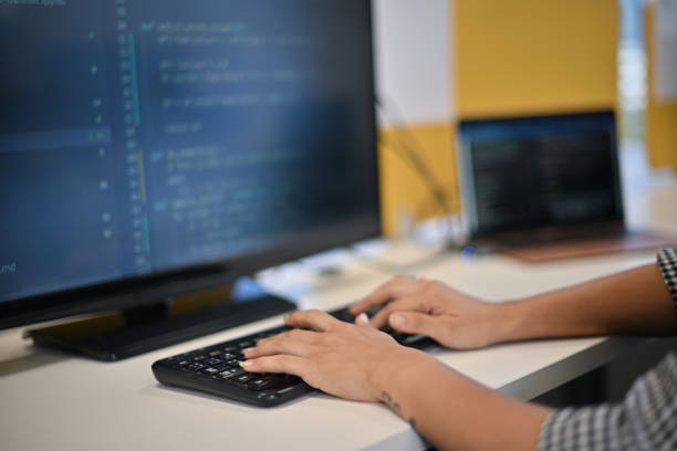 istock Cropped hands of a woman typing on a computer keyboard 1448325491