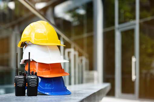 Helmets for construction workers, engineers, technicians, inspectors who work on construction sites. Safety hardhat while working to prevent accidents. work equipment of Blue collar