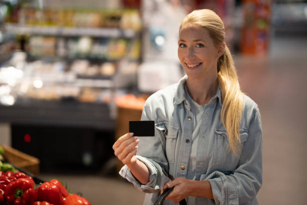 istock A woman pays with a credit card 1448330213