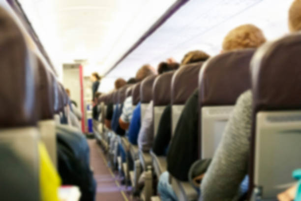 istock Blur background of passenger plane cabin 1448331269