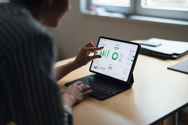 istock View From Behind of an Anonymous Woman Using a Tablet (Copy Space) 1448331312